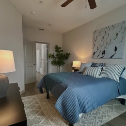 a bedroom with a bed and a dresser